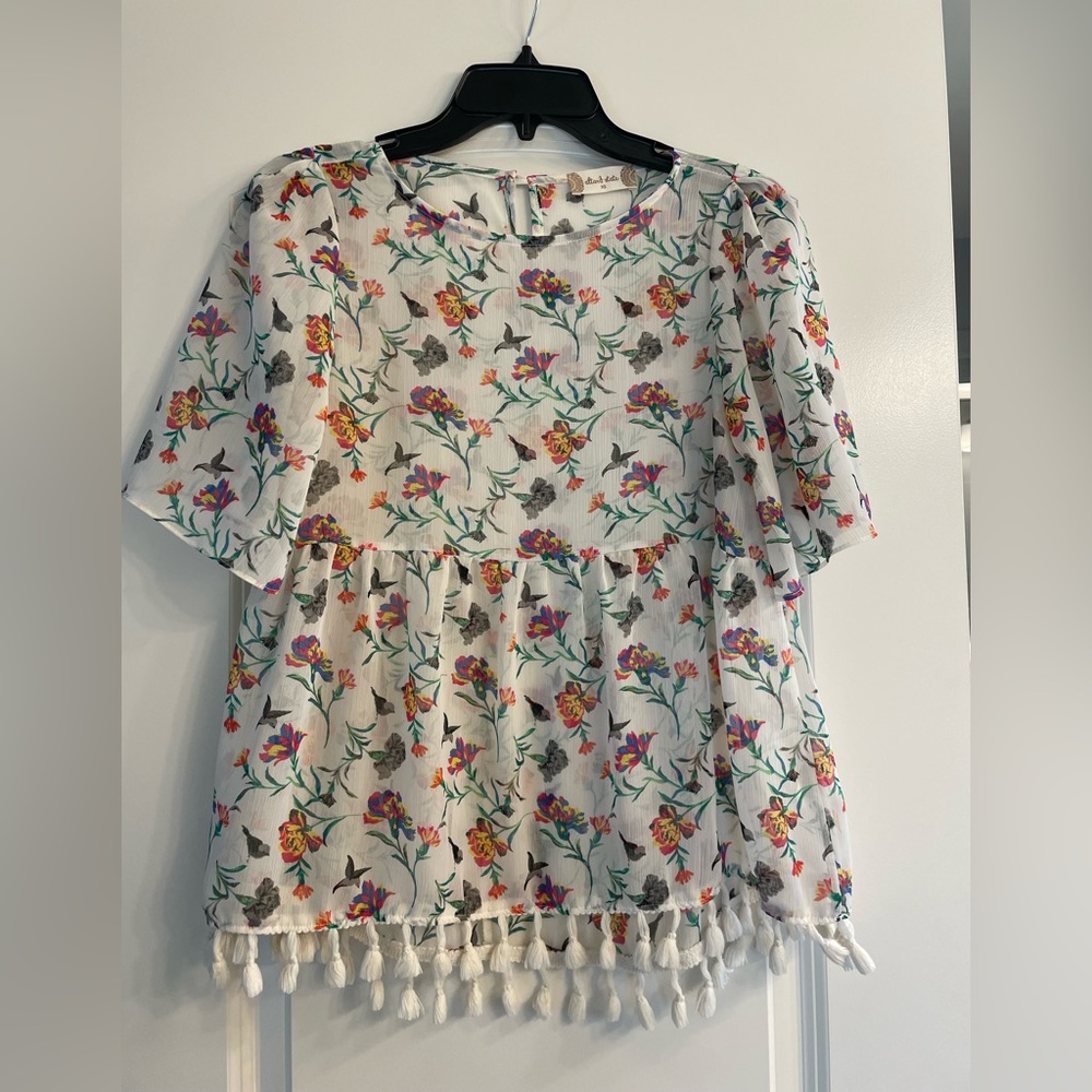 Floral peplum tassel top